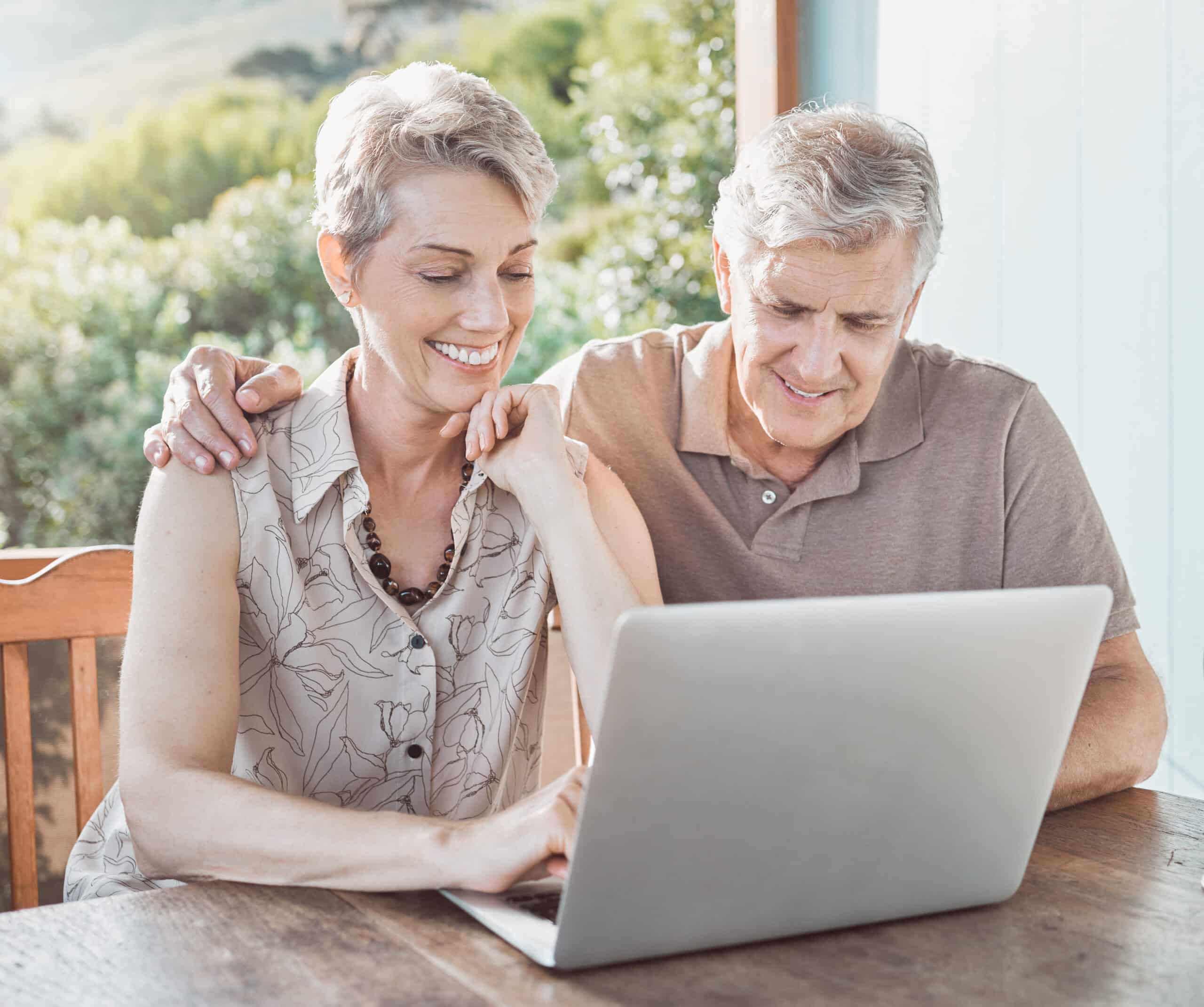 couple on laptop - book your stay